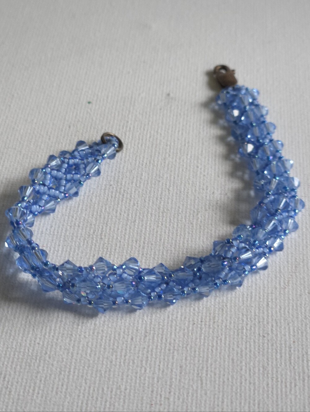 ​Handcrafted Blue Crystal Bicone Woven Bead Bracelet Iridescent AB Bronze Clasp